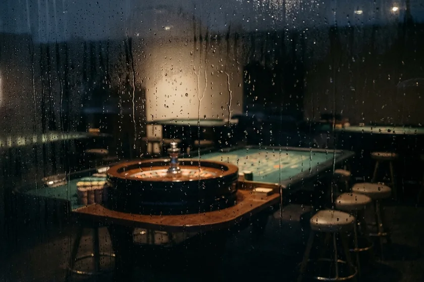 Blurred roulette wheel and table in warm light